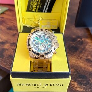 Invicta Gold Watch with Vibrant Blue Accents